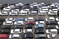Used cars to be shipped to Russia are parked at a port in the city of Toyama last August. | Kyodo

