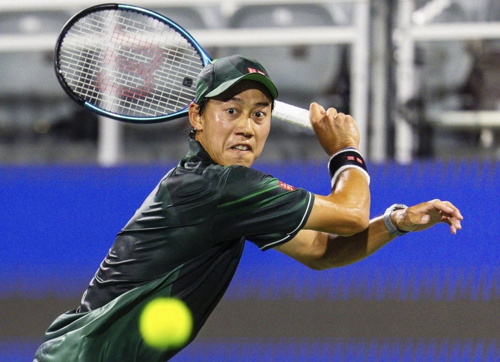 Kei Nishikori hits a return against Shang Juncheng during their match at the Atlanta Open on Thursday.