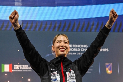 Fencer Misaki Emura celebrates after winning the women's sabre title at the world championships in Milan on Thursday.
