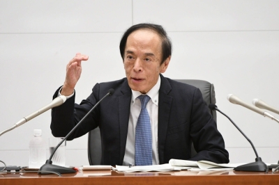 Bank of Japan Gov. Kazuo Ueda speaks during a news conference at the central bank's headquarters in Tokyo on Friday.