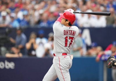 Los Angeles Angels designated hitter Shohei Ohtani hits a home run against the Toronto Blue Jays during the first inning at Rogers Center in Toronto on Friday. 