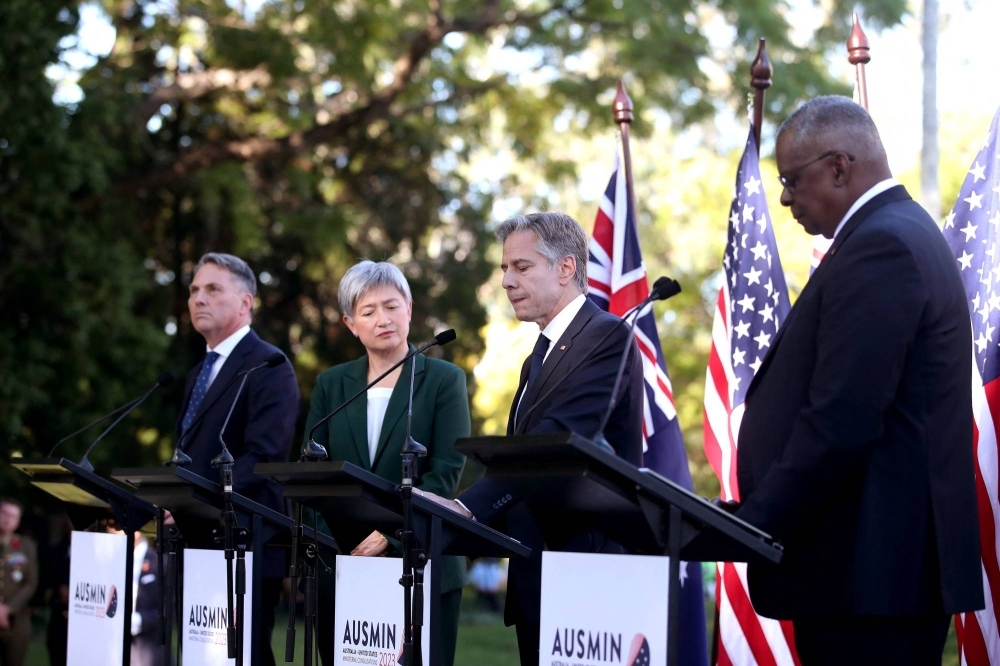 From left: Australian Defence Minister Richard Marles, Australian Foreign Minister Penny Wong, U.S. Secretary of State Antony Blinken and U.S. Secretary of Defense Lloyd Austin hold a news conference in Brisbane on Saturday. 
