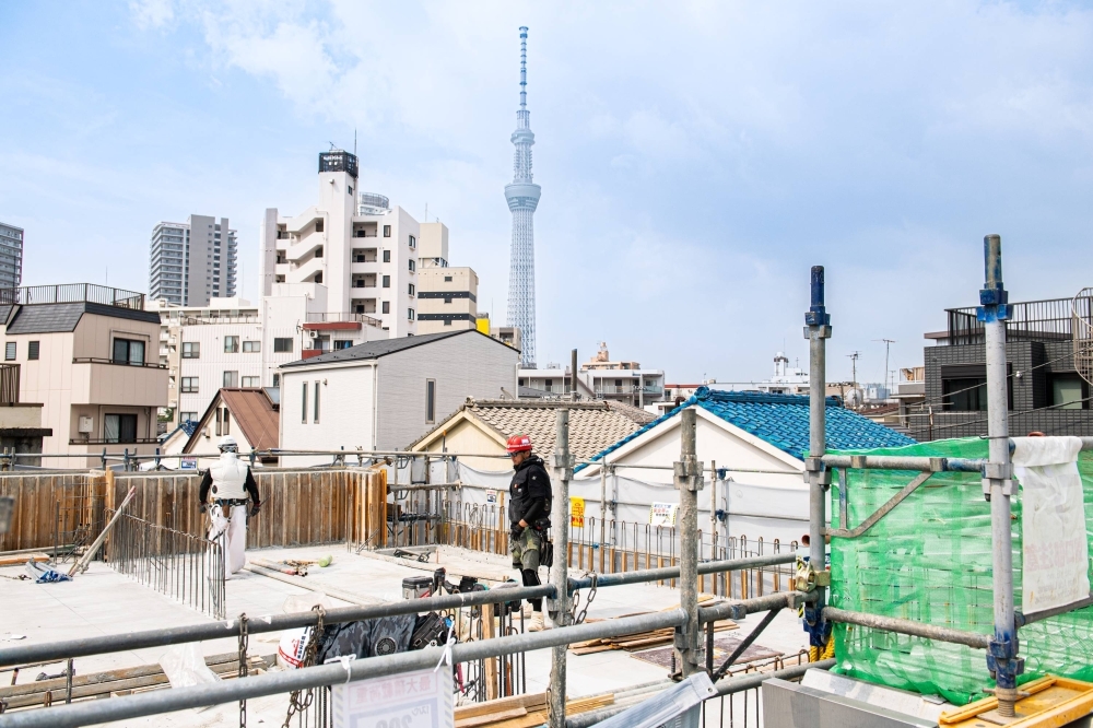 An apartment building construction site in Sumida Ward, Tokyo, on July 19. Officials at Daito Trust Construction, which oversees the building project, say heatstroke dangers are a top concern given their aging workforce.