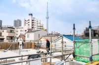 An apartment building construction site in Sumida Ward, Tokyo, on July 19. Officials at Daito Trust Construction, which oversees the building project, say heatstroke dangers are a top concern given their aging workforce. | Louise Claire WAGNER