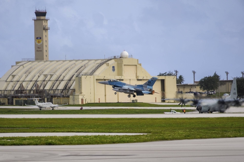 An American F-15 jet takes off from Anderson Air Force Base in Guam earlier this year. The U.S. is hunting for malicious computer code it believes China has hidden deep inside the networks controlling power grids, communications systems and water supplies that feed military bases in the United States and around the world.