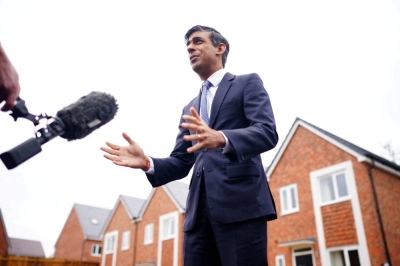 British Prime Minister Rishi Sunak speaks to the media during a visit to Cofton Park, near Rednal, England, on July 24.