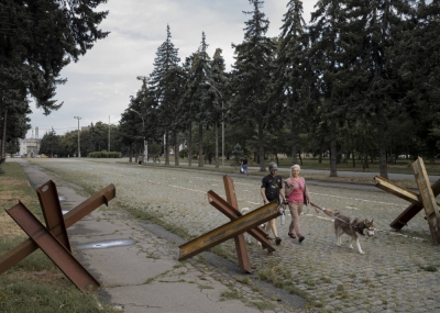 Pedestrians passing anti-tank obstacles in Odesa, Ukraine, on Thursday