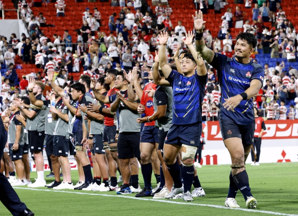 Japan's players celebrate after their international test win over Tonga at Hanazono Stadium in Osaka Prefecture on Saturday.