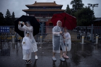 Officials closed the gates of the Forbidden City due to heavy rain in Beijing on Sunday. | REUTERS