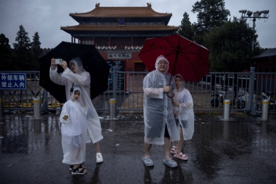 Officials closed the gates of the Forbidden City due to heavy rain in Beijing on Sunday.