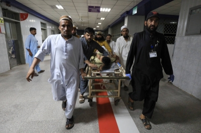An injured person is transported after a blast in Bajaur district of Khyber Pakhtunkhwa, at the Lady Reading Hospital in Peshawar, Pakistan, on Sunday.