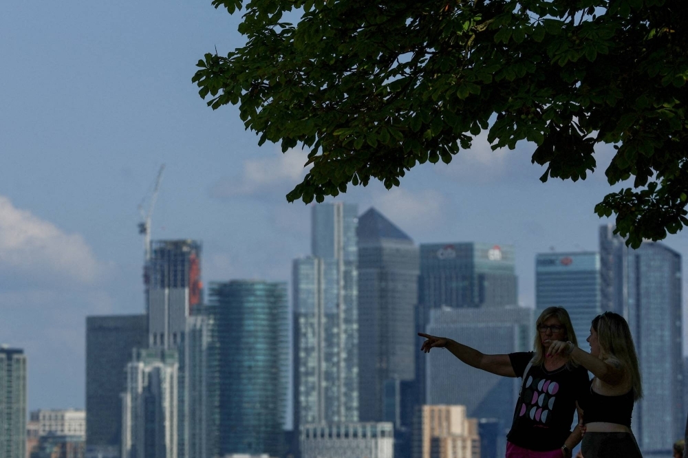 The towers of Canary Wharf, in London, occupied by several major international banks, seen from Greenwich Park in the city