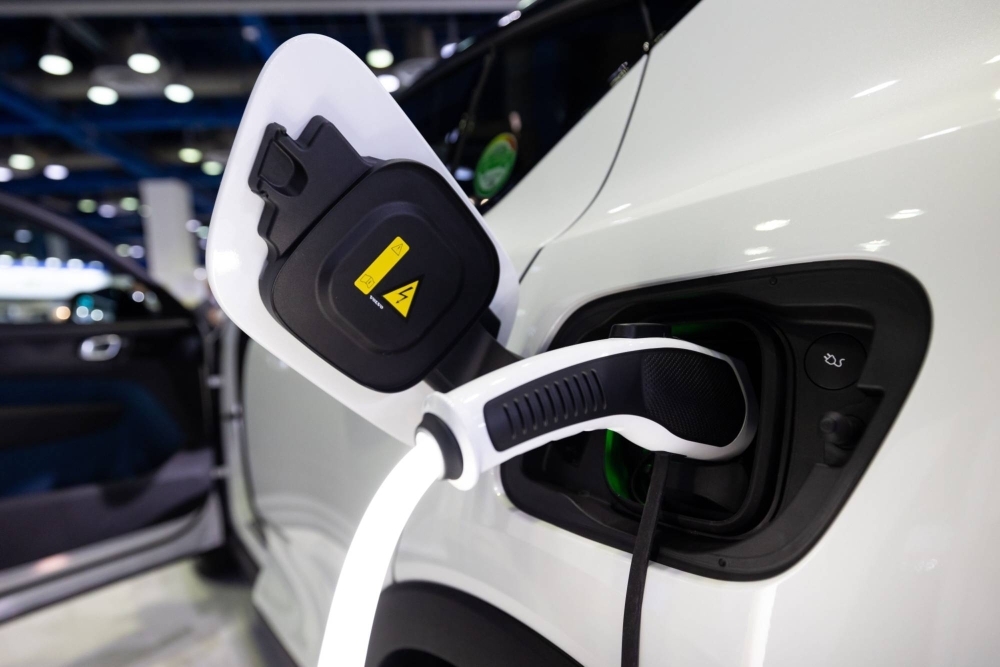 A cable is connected to a Volvo AB XC40 electric sports utility vehicle displayed at the EV Trend Korea exhibition in Seoul in March 2022.