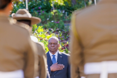U.S. Defense Secretary Lloyd Austin stands for the U.S. national anthem before a meeting with his Australian counterpart ahead of the Australia-U.S. Ministerial Consultations in Brisbane on Friday.