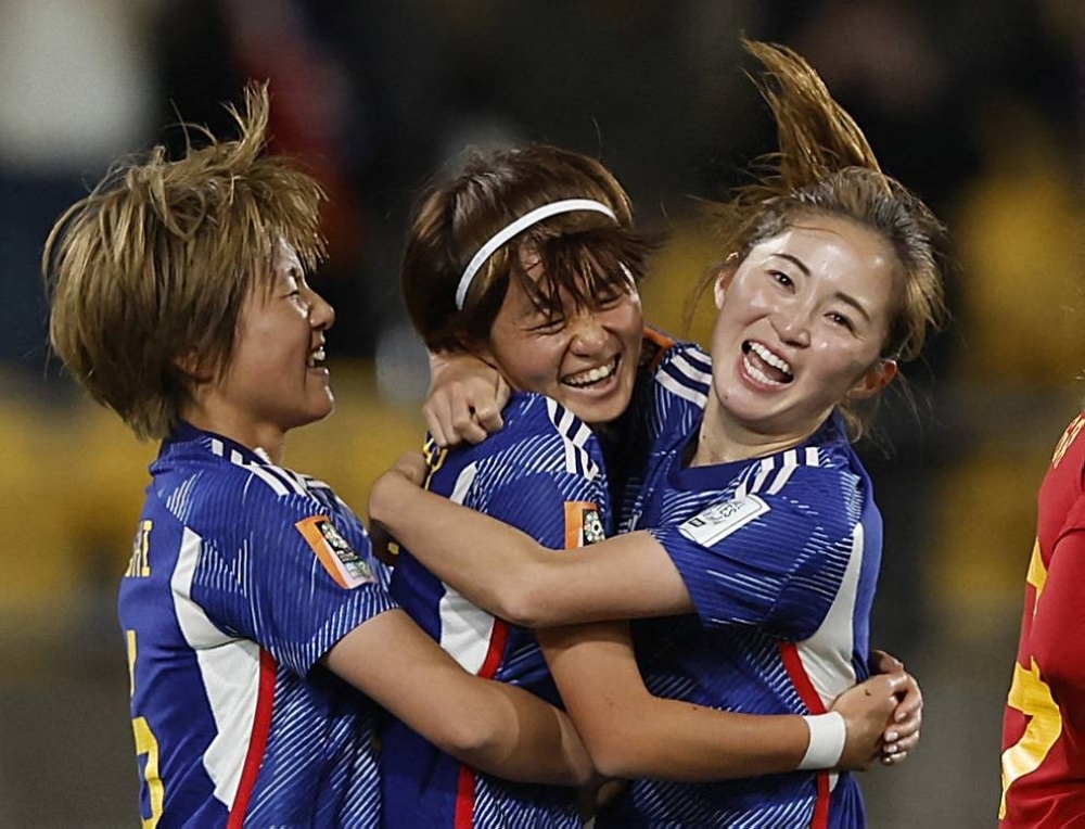 Japan's Hinata Miyazawa (center) celebrates with Risa Shimizu (right) and Honoka Hayashi after scoring her second goal during Japan's 4-0 win over Spain during the Women's World Cup in Wellington on Monday.