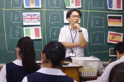 A teacher gives an English lesson in the city of Saitama on July 12.
