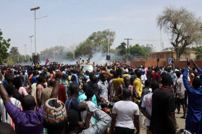 Nigerien security forces launch tear gas to disperse pro-junta demonstrators gathered outside the French embassy, in Niamey, the capital city of Niger, on Sunday.