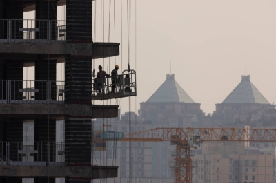 A new high-rise is erected in Beijing in October 2021. The same year, 41% of the assets in China’s banking system were accounted for by property-related loans and credit.