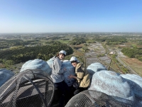 People participate in a tour to climb to the top of a 120-meter Daibutsu statue in Ushiku, Ibaraki Prefecture. The tour is offered as a gift in return for donations under the furusato nōzei (hometown tax donation) system. | The city of Ushiku / via Kyodo 
