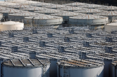 Tanks containing water from the disabled Fukushima No. 1 nuclear power plant are seen at the plant in the town of Okuma, Fukushima Prefecture, in March.