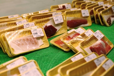 Packs of raw fish at a Japanese food store in Beijing on July 25