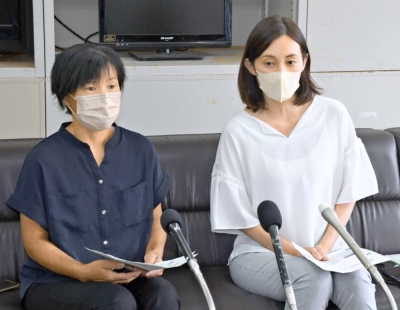 Chihiro Okada (right), a representative of Animal Rights Center, during a news conference at the Okinawa Prefectural Government building on July 10