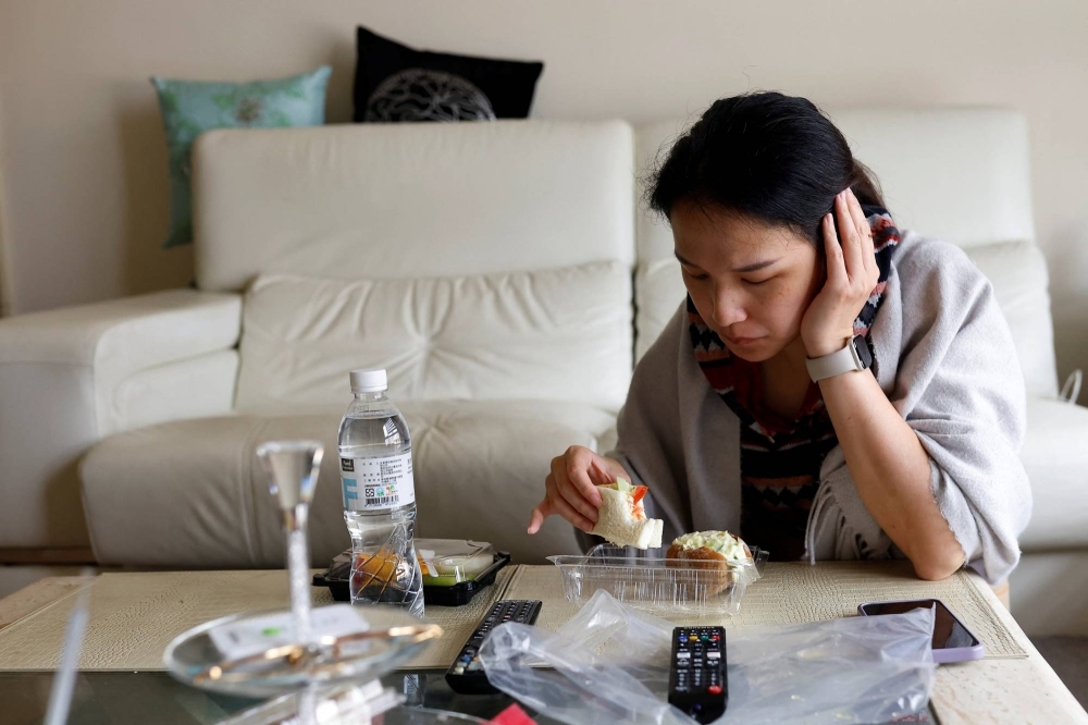 Vivian Tung eats her first meal since the egg retrieval surgery. Tung is one of a rising number of women in Taiwan opting to freeze their eggs to give them the option to have a child later in life.