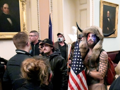 Jacob Anthony Chansley near the entrance to the Senate after breaching security defenses on Jan. 6, 2021