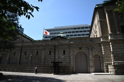 The Bank of Japan headquarters in Tokyo. BOJ Deputy Gov. Shinichi Uchida has said there is still a long way to go before conditions fall into place for the bank to raise its short-term interest rate target.