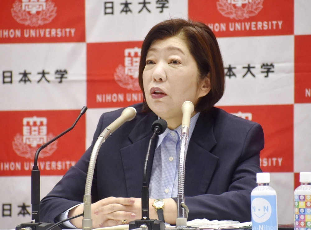 Mariko Hayashi, head of the board at Nihon University, speaks to reporters in Tokyo on July 11.