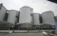 Storage tanks containing treated radioactive water at Tokyo Electric Power Company Holdings' Fukushima No. 1 nuclear power plant in Futaba, Fukuahima Prefecture, on July 21 | EPA / via Bloomberg