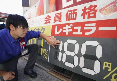 A price board at a gas station in Tokyo shows regular gasoline at ¥180 yen per liter on Wednesday.