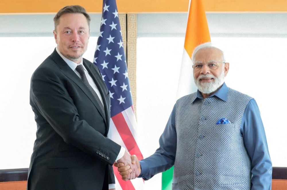 India's Prime Minister Narendra Modi shakes hand with Tesla chief executive Elon Musk in New York on June 20, 2023. 