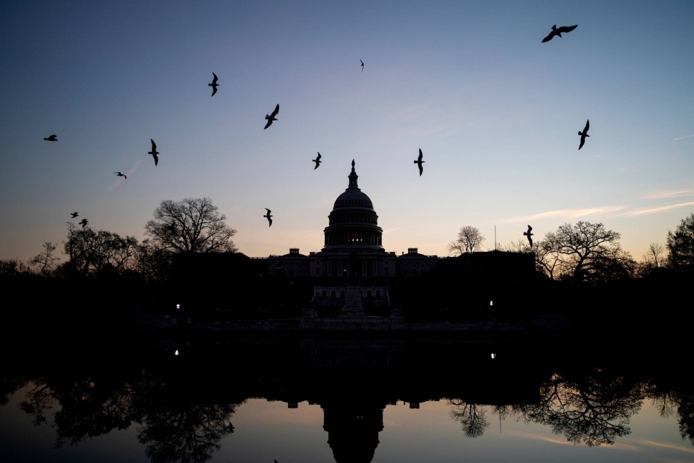 A downgrade by Fitch Ratings is being viewed as a condemnation of partisan U.S. politics, including the recent debt ceiling standoff and the Jan. 6, 2021, insurrection at the U.S. Capitol.