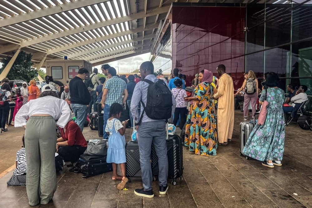 Citizens of European countries are seen outside the Diori Hamani International Airport, apparently evacuating the country, in Niamey, Nigeria on Wednesday.