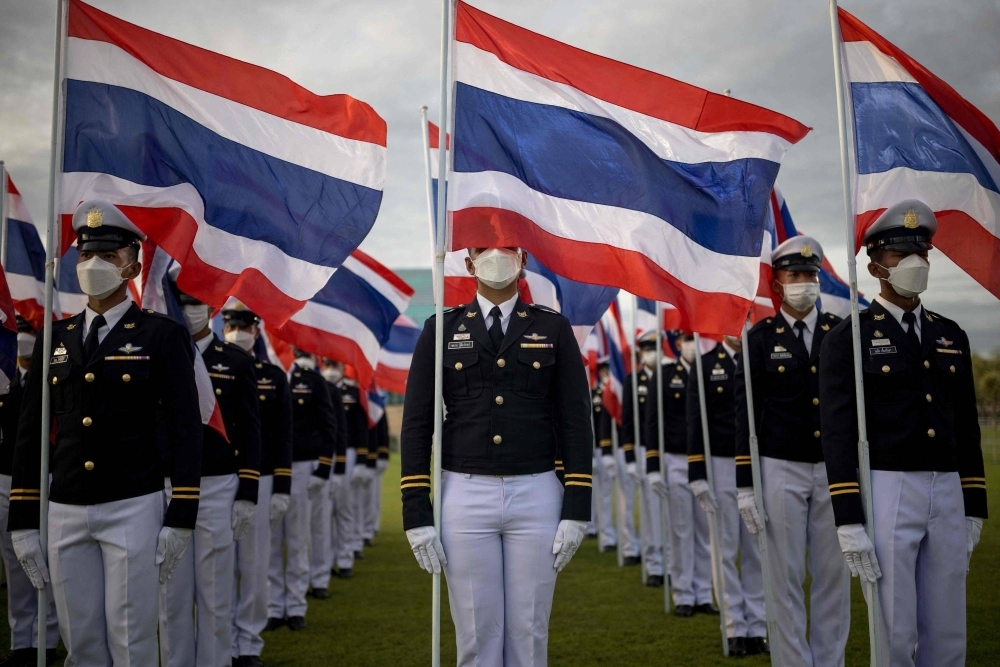 Members of the armed forces stand with flags of Thailand outside the Grand Palace during celebrations to mark King Maha Vajiralongkorn's 71st birthday in Bangkok on July 28.