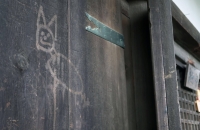 A wooden door of a Todaiji temple building in Nara Prefecture after it was vandalized with an image of what looks like a cat on Thursday. | Kyodo