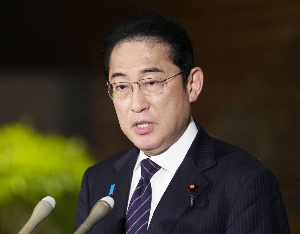 Prime Minister Fumio Kishida speaks to reporters in Tokyo on July 28.