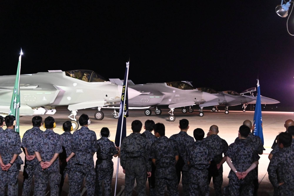 Four Italian Air Force F-35 fighter jets are lined up next to an Air Self-Defense Force F-15 fighter shortly after arriving at Komatsu Air Base in Ishikawa Prefecture on Friday evening in this image posted to the base's official X social media account.
