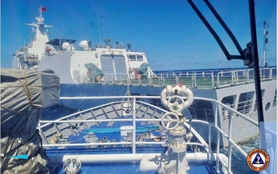 A China Coast Guard boat allegedly blocks Philippine Coast Guard vessels, which were escorting a resupply mission for the Philippine troops stationed at the Second Thomas Shoal in the South China Sea on Saturday.