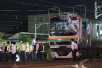 A JR train hit a power pole on Saturday night that had fallen onto the tracks between Fujisawa and Ofuna stations in Kanagawa Prefecture near Tokyo. | Kyodo