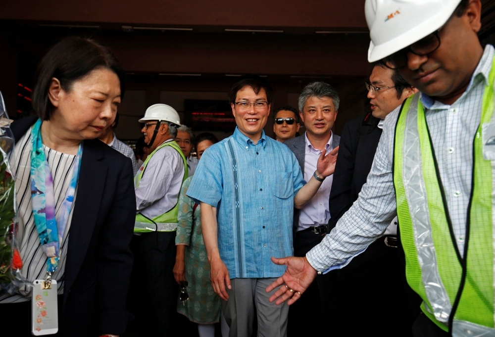 Japanese lawmaker Masatoshi Akimoto visits a high-speed rail project site in Ahmedabad, India, in May 2018.
