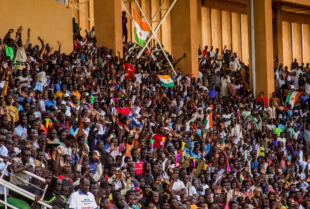 Supporters of Niger's coup leaders take part in a rally at a stadium in Niamey, Niger, on Sunday.