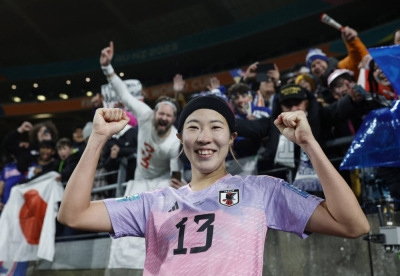 Japan's Jun Endo celebrates with fans after the team's last-16 win over Norway during the Women's World Cup in Wellington on Saturday.