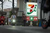 Warabeya Nichiyo Holdings has apologized after a video went viral that showed one of its rice ball products appearing to contain a cockroach at a Seven Eleven convenience store. | Bloomberg
