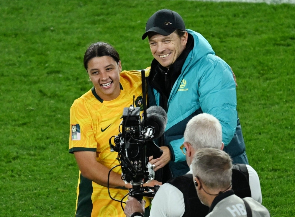 Australia's Sam Kerr (left) and head coach Tony Gustavsson celebrate after progressing to the quarterfinals of the 2023 FIFA Women's World Cup in Sydney on Monday.