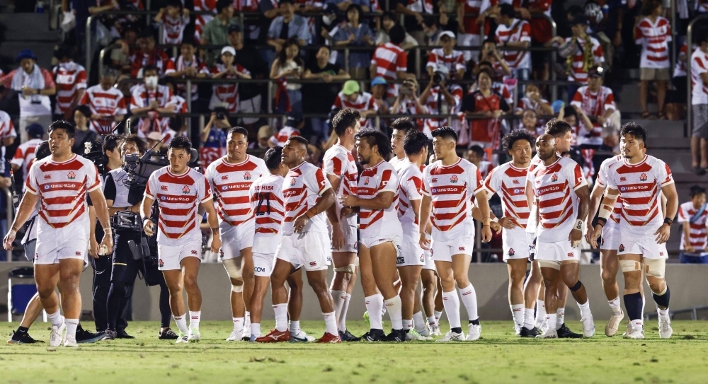 Japan's Brave Blossoms react after their defeat to Fuji in an international test at Prince Chichibu Memorial Rugby Ground on Saturday.