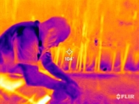 A landscape worker from Mexico takes a break during a heat wave in Phoenix, Arizona, on July 27. A thermal camera registered surface temperatures of 40 degrees Celsius, with an air temperature of 42 C. | REUTERS