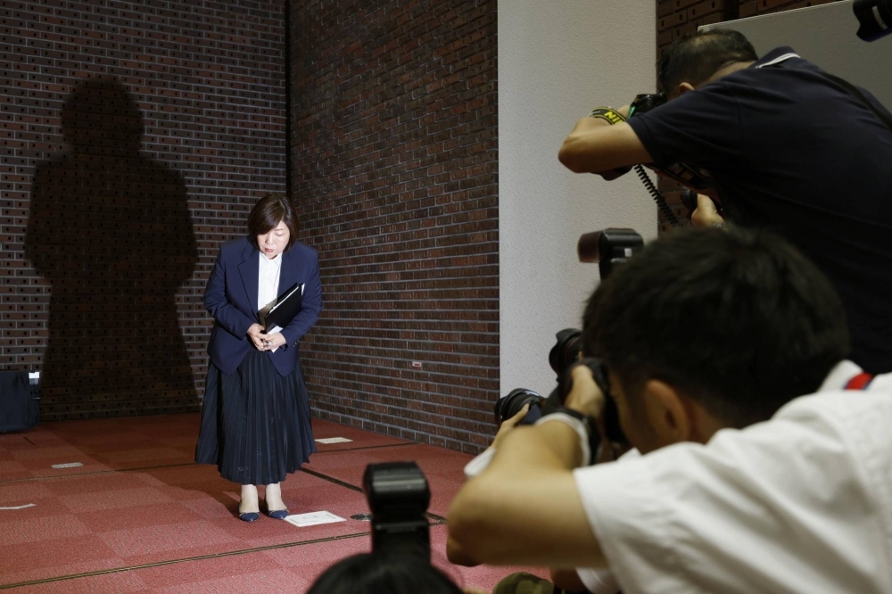 Mariko Hayashi, chairwoman of the board of trustees at Nihon University, bows to the media after giving a news conference in Tokyo on Tuesday.