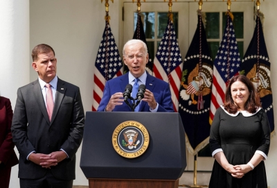 U.S. President Joe Biden is flanked by Labor Secretary Marty Walsh (left) and Celeste Drake while delivering remarks at the White House in Washington in 2022.